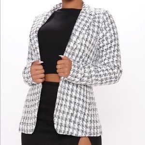 Black and white blazer.